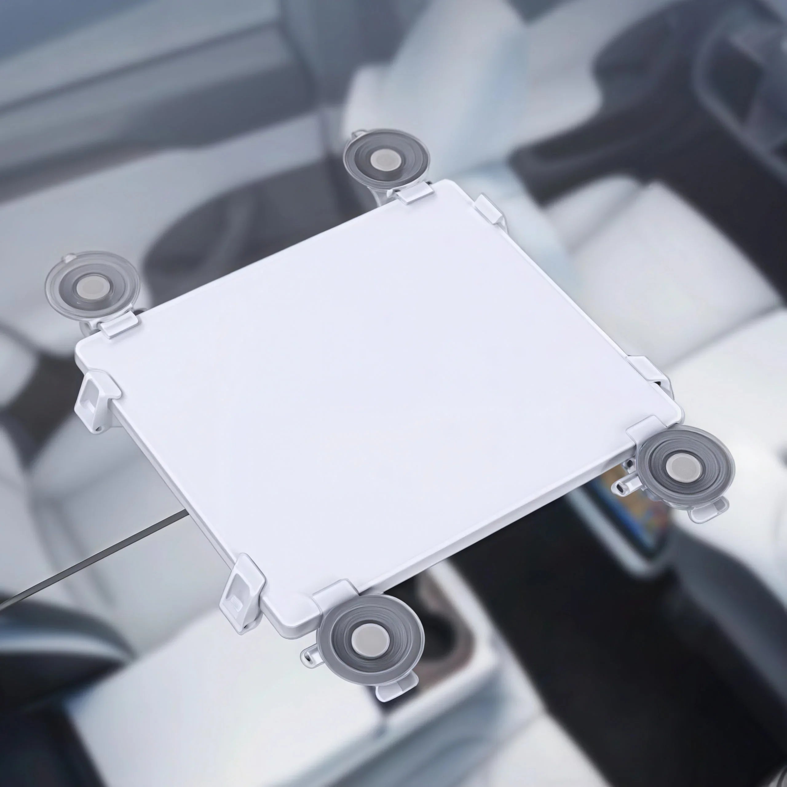 White Starlink Gen 3 mount with suction cups for car roof installation